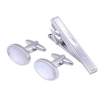 Vente en gros d'accessoires de bijoux personnalisés de haute qualité pour hommes ensemble de boutons de manchette pince à cravate coquille plaqué or en laiton