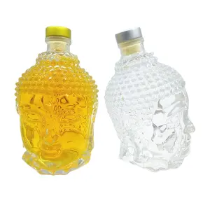 High quality buddha head shape vodka / wine / tequila / gin glass bottle 750ml with stopper lid