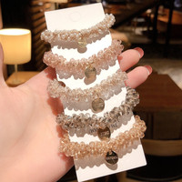 2025 Ins accessoires de cheveux les plus populaires décoratifs cristal élastique perle cheveux cravates Bracelets pour femmes filles