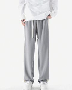 กางเกงวอร์มผู้ชายแบบมีโลโก้ 3 มิติ ปั๊มนูน ขอบเอวคู่ ลายทาง ล้างสีแบบแอซิด ทรงขาบาน - Product Image 5