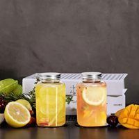 Canette en plastique transparente de bouteille de jus d'animal familier de catégorie comestible de haute qualité avec la forme ronde de logo personnalisé pour la boisson de Soda
