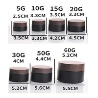 Pot cosmétique vide rechargeable en verre noir givré avec logo personnalisé Conteneur d'ombre à paupières crème pour le visage avec bouchon en grain de bois