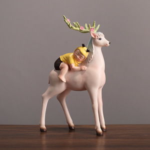 Adorno de resina de niño montando un ciervo de estilo nórdico para decoración de sala de estar y dormitorio - Product Image 1