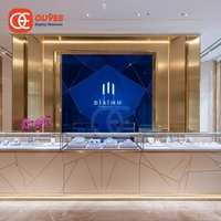 Comptoir de présentation de bijoux de luxe avec cadre métallique et éclairage LED pour boutique de marque