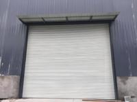 Porte de garage extérieure de style américain, résistante aux ouragans, en acier galvanisé, avec volets roulants de sécurité