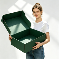Boîte d'emballage d'expédition pour vêtements en carton ondulé noir recyclé écologique avec logo personnalisé et protection en mousse, vente en gros