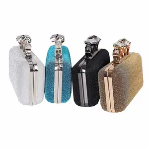 Four ring heads glitter and sparkle material clutch bag evening
