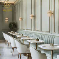 Mobilier de restaurant Ron Group : banquette en velours, table carrée en marbre, chaise personnalisée pour restaurant