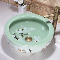 Fregaderos de baño de cerámica de flor de ciruelo redondo pintado a mano con arte sobre encimera verde esmaltado a la venta