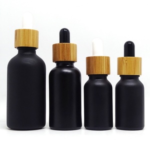 Venta al por Mayor de Botellas de Vidrio Natural de 15 ml, 1 oz, 30 ml, 100 ml, Color Azul, Verde, Ámbar, Negro, Transparente, Esmerilado, con Gotero y Tapa de Bambú - Product Image 1