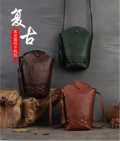Sac seau décontracté en cuir tanné végétal pour femme, style rétro, tressé, mini sac à bandoulière pour téléphone portable avec pompon, en polyester