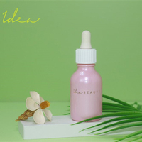 Bouteille de sérum compte-gouttes en verre rose avec logo personnalisé de 30ml pour huiles essentielles