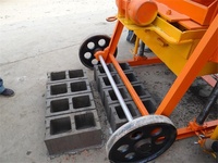 Machine à fabriquer des blocs creux en béton YJ à utilisation facile, machine mobile à grandes roues QMJ4-45 pour la fabrication de briques et de blocs, en promotion