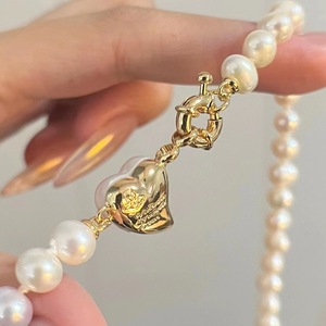 Collier de luxe haut de gamme en perles d'eau douce naturelles pour femme, perles de millet avec pendentif nœud léger et luxueux pour la clavicule - Product Image 4