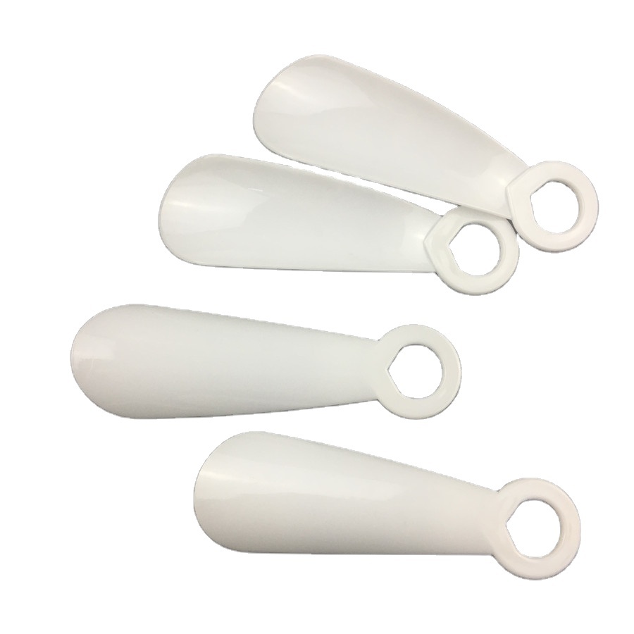 Белые пластиковые обувные рожки длиной 14 см оптом