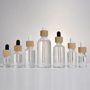 Factory Hot Sale Empty 5ml 10ml 15ml 20ml 30ml 50ml 100ml Clear Essential Oil Glass Dropper Bottle With Bamboo Lid