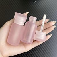 Tube d'emballage de conteneur transparent rose de forme spéciale pour le soin des lèvres Tubes de brillant à lèvres en plastique vides de brillant à lèvres