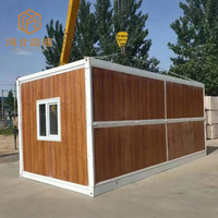 Garage modulaire portatif préfabriqué de voiture de conteneur de structure en acier à faible coût avec l'entrepôt préfabriqué de stockage de porte de volet de rouleau