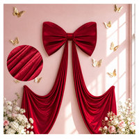 Ornements de nœuds surdimensionnés en velours doré pour la décoration de salles de mariage et les décors de vitrines de centres commerciaux