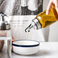 Bouteille d'huile en verre cylindrique transparente avec bouchon en acier inoxydable et bec verseur en forme d'aigle, qualité alimentaire, capacité de 150 ml à 800 ml, option de gravure personnalisée