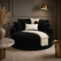 Fauteuil rond moderne en velours côtelé large noir, avec accoudoirs rembourrés, mousse haute densité et structure robuste, pour salon.