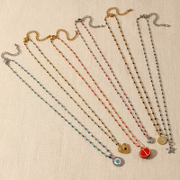 Collier superposé délicat style bohème en acier titane plaqué or PVD 18K avec perles colorées multi-formes, breloques cœur, étoile et pièce de monnaie
