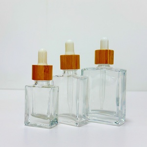 En magasin, flacon d'huile essentielle carré plat de 15 ml, 30 ml, 50 ml, 100 ml, 120 ml, 150 ml, flacon en verre avec tête compte-gouttes en plastique et couvercle en bambou - Product Image 2