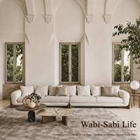 Sofá de Salón Extra Largo de 6 Plazas con Base Escultural de Madera y Tapicería de Tela Bouclé Orgánica en Color Crema Blanco para Villa