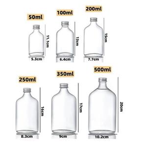 Bouteille vide transparente haut de gamme, plate et ronde, 50 ml/100 ml/250 ml, adaptée au brandy, au gin, au rhum, à la vodka, à la <span class=keywords><strong>tequila</strong></span>, avec bouchon en aluminium - Product Image 5