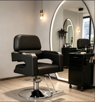 Chaise de salon professionnelle pour coiffeur, en cuir PU noir de luxe, avec repose-pieds en métal et accoudoirs réglables hydrauliquement.