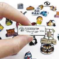 Fabricants de Offre Spéciale Vente en gros Cadeaux d'affaires Épingles à chapeau populaires en alliage d'aluminium de conception animée Logo personnalisé