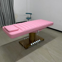 Table de massage électrique de luxe moderne pour hôtel, salon de beauté et spa, avec éclairage et revêtement en cuir PU