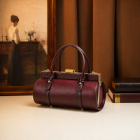 Sac cylindrique noir à imprimé serpent avec logo personnalisé, en cuir PU, fermoir à cadre métallique, sac à bandoulière et sac à main, fournisseur en gros