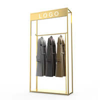 Présentoir personnalisé pour magasin de vêtements pour dames Porte-vêtements en métal Porte-vêtements moderne pour boutiques
