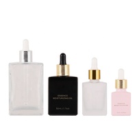 Bouteilles rectangulaires d'huile essentielle de 1oz Barbes 15ml 30ml 50ml 100ml Bouteille carrée en verre noir mat givré Cosmétiques