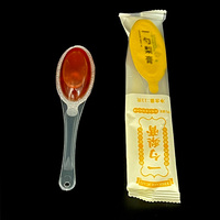 Cuillère à miel en plastique avec couvercle en aluminium thermoscellé et sachet individuel enveloppé de cuillère à miel