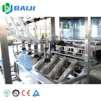 Ligne de production de remplissage et de bouchage automatique de bouteilles d'eau potable de 20 litres (5 gallons) à haut rendement, garantie de 2 ans