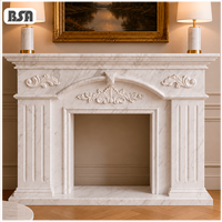Cheminée en marbre blanc de Carrare classique BSA, sculptée à la main avec des motifs floraux en relief, pour la décoration intérieure de la maison et de la villa