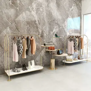 Estante colgante para exhibición de ropa, estantería con tablero de grano de mármol, oro único, Boutique