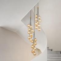 Lustre de luxe moderne en verre ambré à plusieurs têtes, en forme de globe, pour escalier en colimaçon, lampe suspendue longue verticale pour hall duplex, plafond haut, foyer