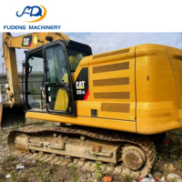 Excavatrice sur chenilles CAT 320GC d'occasion bien entretenue, 20 tonnes, avec godet de 1,1 m³ pour les travaux de pose de canalisations en construction urbaine