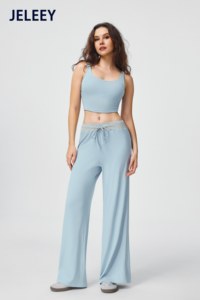 Matching set featuring a sports vest and loose-fitting, straight-leg <b>trousers</b> with an adjustable <b>drawstring</b>. - Product Image 2