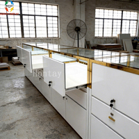 Vitrine à bijoux de luxe en aluminium et verre trempé, cadre doré poli, rétroéclairage LED, miroir à motif diamant, personnalisable