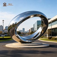 Grande sculpture d'anneau en acier inoxydable poli, art moderne d'extérieur, pièce maîtresse paysagère pour rondel de voie d'accès