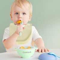 Nouveau modèle de bavoirs en silicone imperméables pour nourrissons bavoirs à bouton réglable bavoirs en silicone pour bébés avec attrape-nourriture