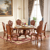 Ensemble de table à manger ronde en bois massif de style vintage européen avec plateau tournant et chaises en cuir PU sculptées à la main, mobilier de salle à manger en gros