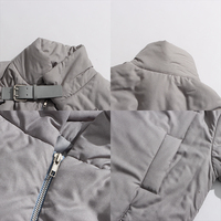 Blouson matelassé chic à col montant pour femme, avec ceinture décorative à boucle, fermeture éclair, épaules tombantes, manteau court d'hiver, vente en gros