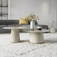 Ensemble de table basse nordique moderne avec plateau en pierre frittée, finition en cuir synthétique et base en métal pour la maison