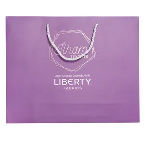 Emballage en carton de marque boutique personnalisé sac à provisions de cadeau bon marché brillant avec votre propre logo pour les petites entreprises