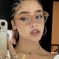 Lunettes anti-lumière bleue colorées à double couleur uniques avec monture métallique creuse et décoration optique œil de chat papillon